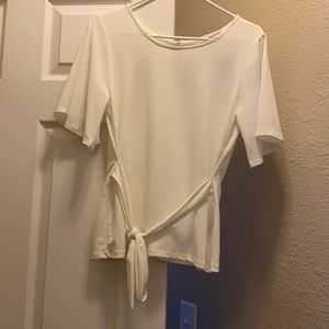 Off white. Medium blouse. Green envelope.